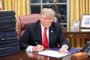 President Trump signing an executive order in the White House.